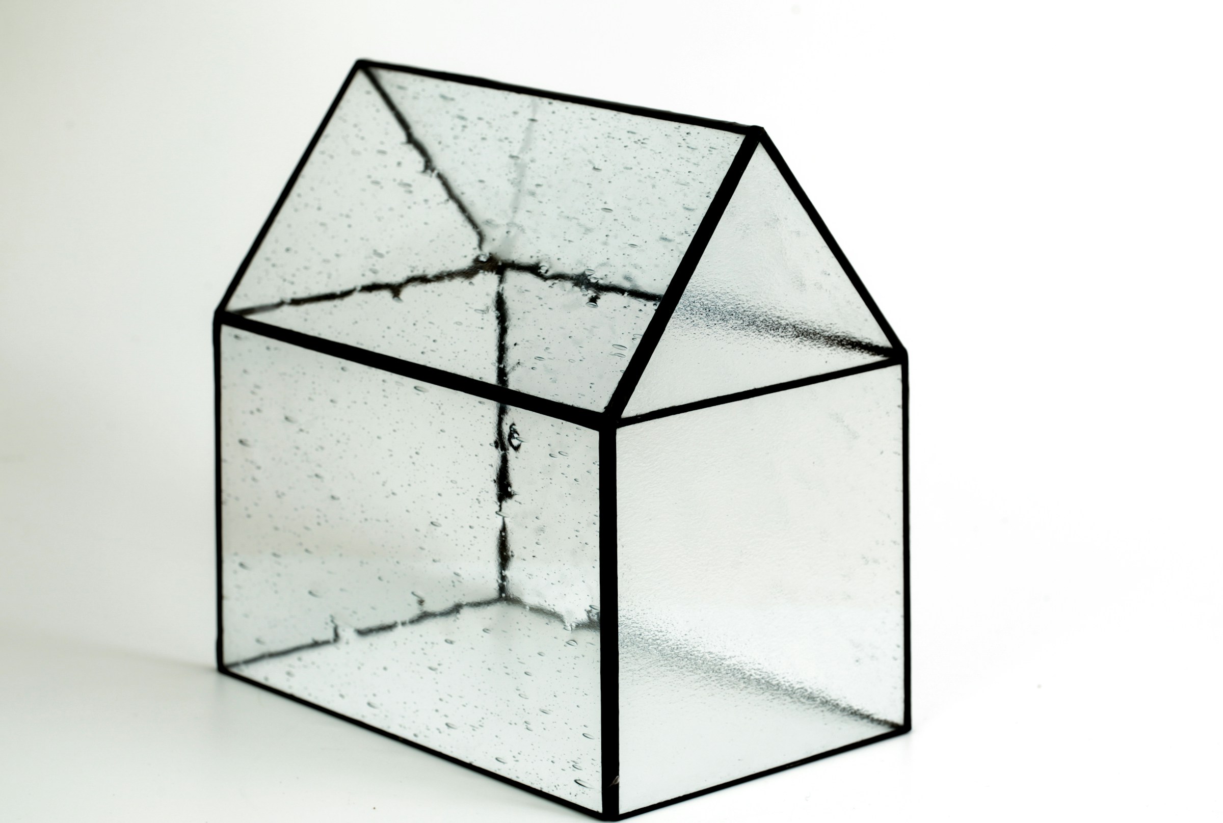 Transparent model of a building illustrating the trend towards open-source AI and the need for increased transparency around the development of artificial intelligence models to build trust, reduce risk, and improve security.